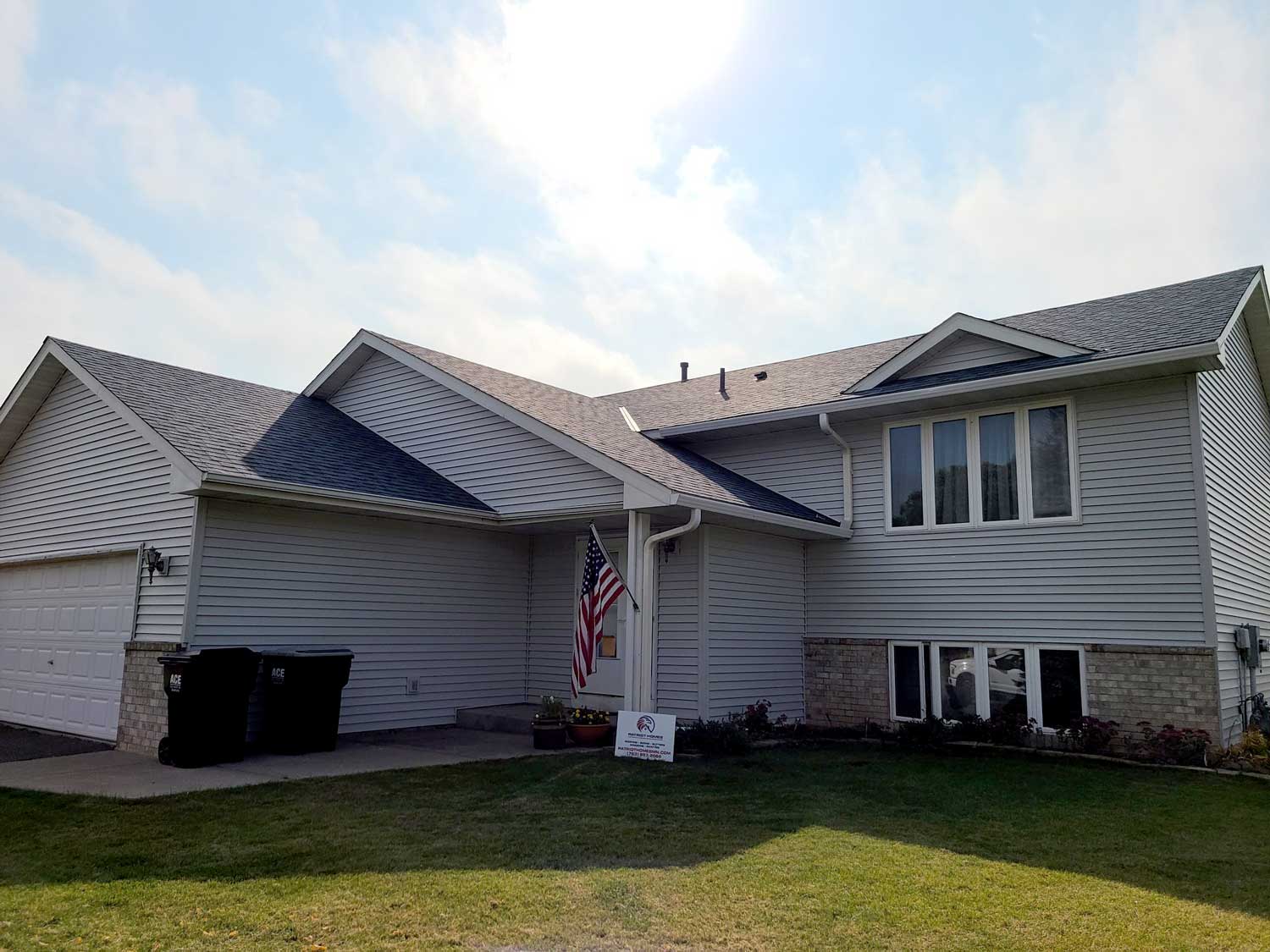 Patriot Homes After Photo of Siding and roofing restoration work.