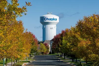 Road leading to Chaska, MN Water tower in the autumn